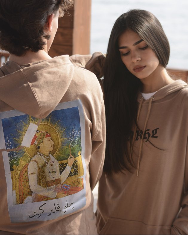 Two people in Chalo Fire Karain hoodies