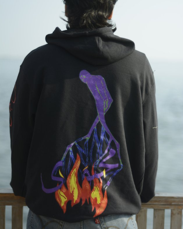 Back of the Pasoori hoodie by the sea